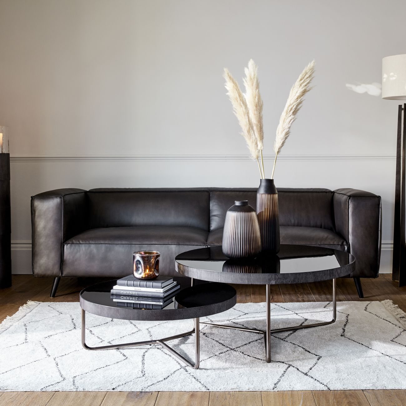 Coffee table with black 2024 leather sofa